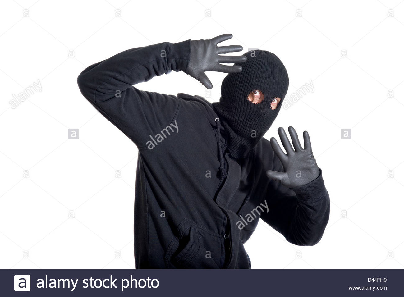 catch-the-burglar-concept-thief-with-balaclava-caught-isolated-on-D44FH9.jpg