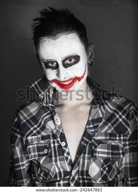 evil-joker-smiling-600w-242647861.jpg