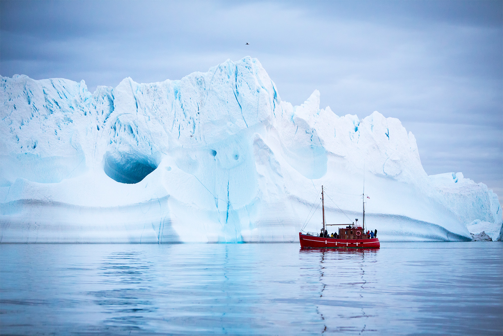 Tourist-boat-front-iceberg-Greenland-coast.jpg